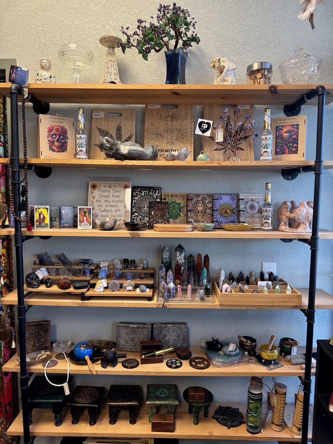 Crystal shelves, tarot, and altar pieces at Faded Walls